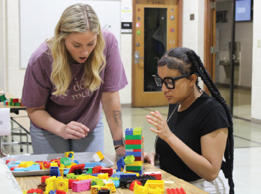 girl building with legos